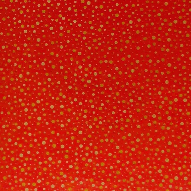 Cadeaupapier spiegel glanzende gouden stippen in een diep matte rode achtergrond..
 